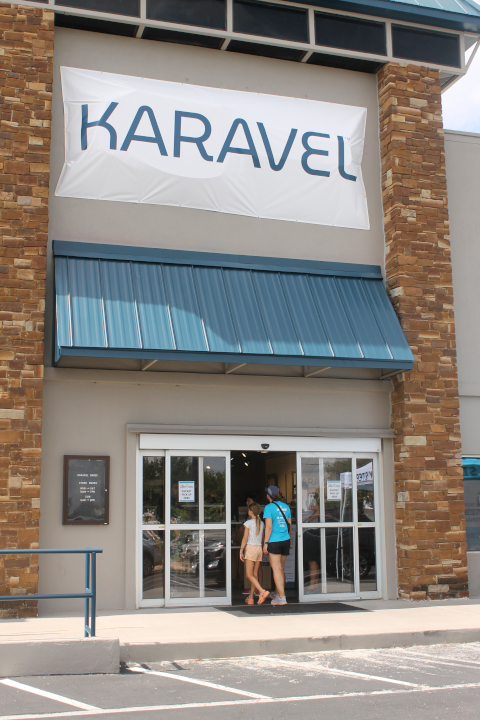 Karavel Shoes entrance with two people walking in.
