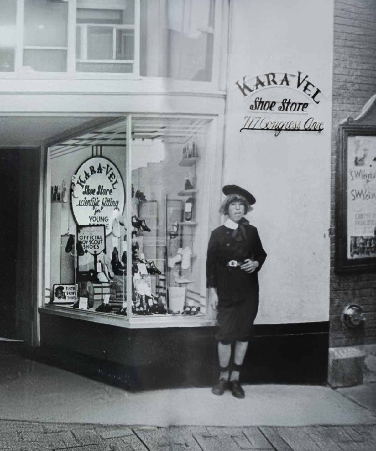 Buster Brown Shoes employee standing in front of Karavel Shoes.