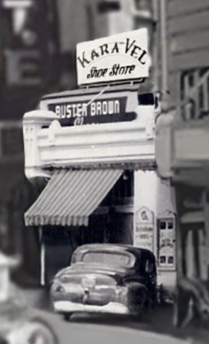 Buster Brown Shoes employee standing in front of Karavel Shoes.
